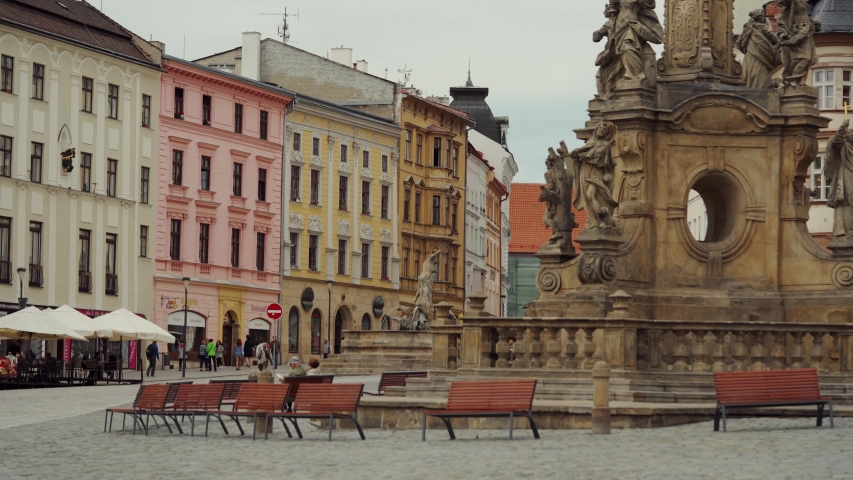 Old Town Upper square at morning in Olomouc, Czech Republic view on Holy Trinity Column and old architecture. place with empty benches for relaxation
