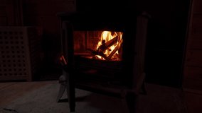Burning Fire In The Fireplace. Wood And Embers In The Fireplace Detailed fire background. A looping clip of a fireplace with medium size flames
