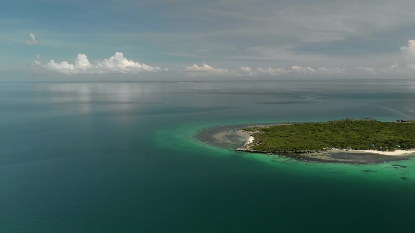 Flying over beautiful beach of tiny Virgin Island, Bantayan, Cebu, Philippines. Aerial view of turquoise tropical lagoon, azure water. Travel. Holidays
