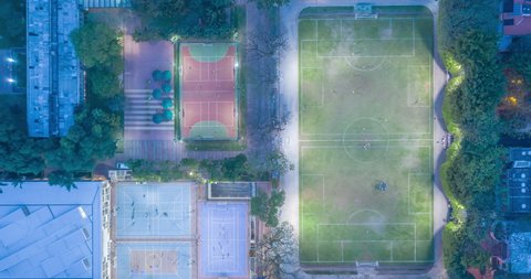Aerial hyperlapse of bird's eye view from sports courts with people playing