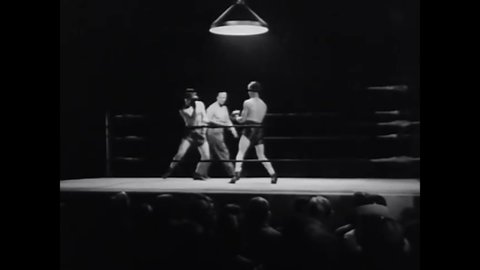 CIRCA 1941 - One of the East Side Kids (Leo Gorcey) performs well in his first round of boxing, surprising some of the spectators.