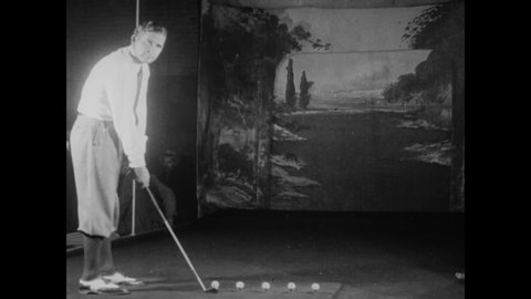 CIRCA 1930 - Australian golfer Joe Kirkwood performs a series of trick shots, some of which involve hitting balls off tees positioned on bodies.