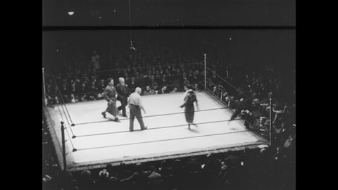 CIRCA 1930 - A professional wrestling match takes place.