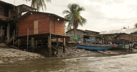 NUQUI, COLOMBIA - APRIL 17, 2019: Boat ride by the village of Nuqui in Choco region of Colombia. A poor area by the Pacific Ocean inhabited mostly by black people