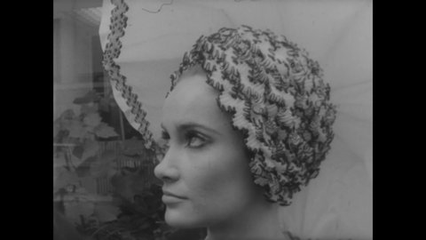 CIRCA 1967 - Women model Dior's new line of hats in Paris, France.