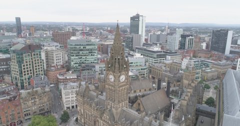 Manchester England aerial shot. Houses, downtown, streets, tower, cars, panorama, old town, new city, beautiful drone.