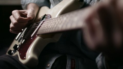 Musician playing the guitar during a live performance. Shot on RED camera in 4k.