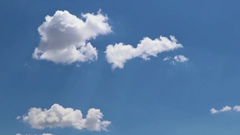 Open sky cloud mass cotton clouds background blue outdoor moving cloud cluster swirling upward. Cloud moving and transforming fast in deep clear blue sky over land with. Time lapse cloud beautiful sky