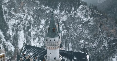 Neuschwanstein Castle in Winter Day . Mountains and Rocks. Bavarian Alps, Germany. Aerial View. Wide Shot. Drone is Orbiting. 4k shot. 18 marth, 2019. part9