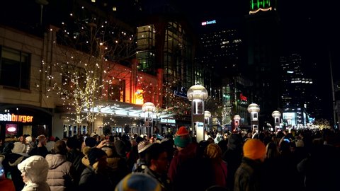 Denver , Colorado / United States - 12 31 2019: Crowd waiting for fireworks in the 16th street of Denver