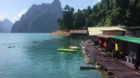 Lake scenery at national park resort at Khao Sok National Park in Southern Thailand is an amazing place. It is covered by the oldest evergreen rainforest in the world, huge limestone mountains shootin