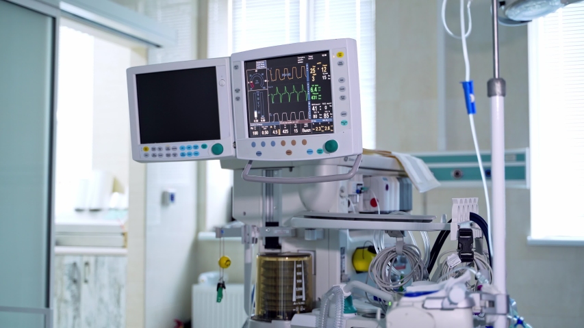 Contemporary medical system in the operating room. Monitor and machine ventilator in hospital theater. Modern equipment to show vital signs of a patient in the hospital. Royalty-Free Stock Footage #1052717474