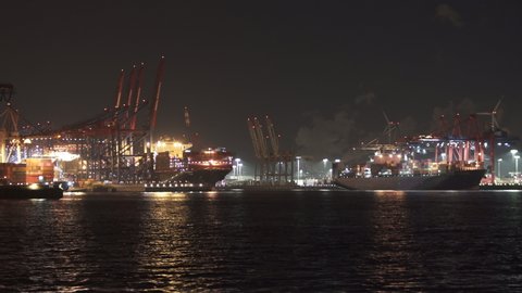 Cargo vessels at night port of Hamburg