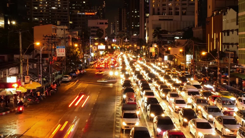 Time lapse traffic lights at 
Asoke Road during the night time. 
Landmark of Bangkok, Thailand Royalty-Free Stock Footage #1052732396