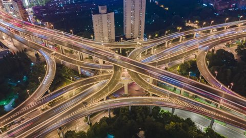 4K Hyper lapse Rising Drone Shot View Reveals Spectacular Elevated Highway and Convergence of Roads, Bridges, Viaducts in Shanghai Night, Transportation and Infrastructure Development China Timelapse.