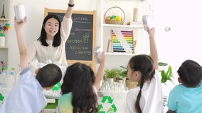 Asian female teacher teaches students about recycling. zero waste, ecological friendly and saving the environment concept. - Powered by Shutterstock - Get 15% off with code: PIKWIZARD15