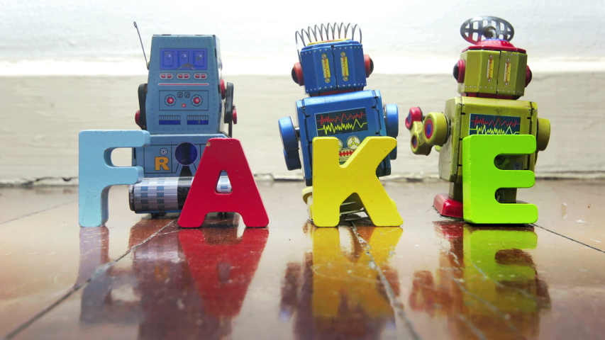 stop motion robots with wooden letters FAKE /FACT	 Royalty-Free Stock Footage #1052753294