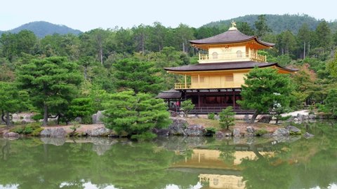 Video of the Golden Pavilion of Zen Buddhist temple Kinkaku-ji, originally a villa called Kitayama-dai, reflecting in the water of the Mirror pond (Kyoko-chi). Kyoto. Japan