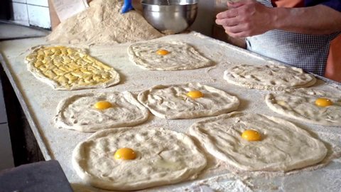 Famous and delicious ramadan breads are being prepared by the masters hands, egg yolk was waiting on dough