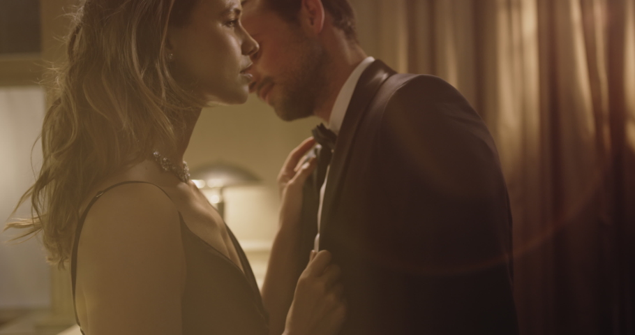 Elegant and stylish couple dancing at a party. Loving young man and woman sharing a sensuous moment at a party.
