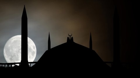 Faisal Mosque by Night, Time Lapse with Full Moon and Silhouette of the Masjid in Islamabad, Pakistan