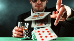 Super slow motion of poker player throwing cards towards camera. Filmed on high speed cinema camera, 1000fps. - Powered by Shutterstock - Get 15% off with code: PIKWIZARD15