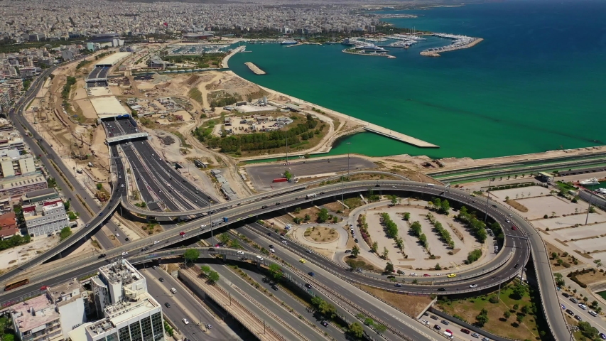 Aerial drone video of National road junction interchange motorway leading to Faliro area, Athens Riviera, Attica, Greece