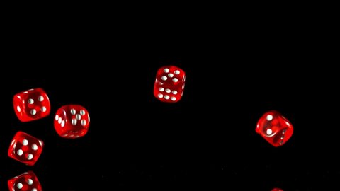 Super slow motion of rolling gaming dices on black table. Filmed on high speed cinema camera, 1000fps.