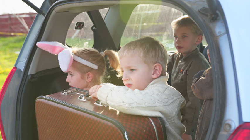 Child in the back of the car.