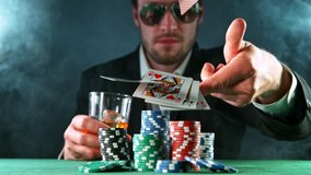 Poker player throwing cards towards camera, super slow motion, filmed on high speed cinema camera at 1000 fps. Gambling background. - Powered by Shutterstock - Get 15% off with code: PIKWIZARD15