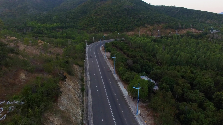 Aerial view of a beautiful moutain road near Nha Trang, Khanh Hoa, Vietnam. The road is flat and fast, good place for bike riding, enjoy the beautiful ocean scenery and moutains along the road