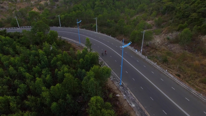 Aerial view of a beautiful moutain road near Nha Trang, Khanh Hoa, Vietnam. The road is flat and fast, good place for bike riding, enjoy the beautiful ocean scenery and moutains along the road