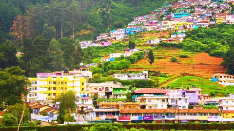 Ooty, India time-lapse during cloudy day. Aerial view of Nilgiri mountain village in Tamil Nadu, India. Ooty is a popular resort with beautiful nature, panning video