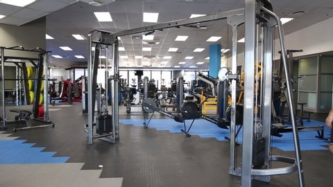 Cape Town, South Africa - May 2020: Strong African Man in Gym Working on Shoulders Wearing Protective Mask, Covid 19, Corona Virus Pandemic in Africa, alone social distancing