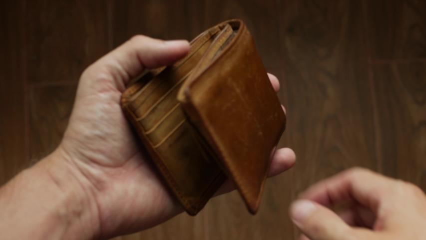 Money in the wallet. Man counting Vietnamese bill notes. A lot of cash. Finance concept. Close-up. 4k