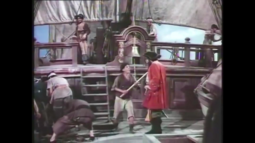 CIRCA 1952 - Blackbeard's (Robert Newton) pirate ship is attacked by the ship of a royal guard in a classic Hollywood adventure film. | Shutterstock HD Video #1052806976