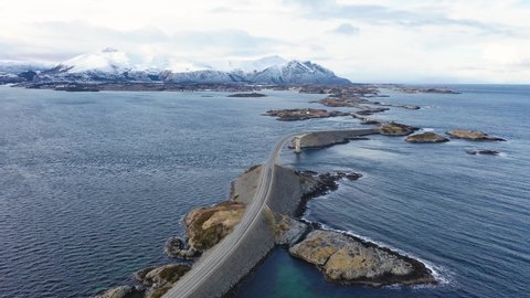 Winter atlantic road in Norway. Aerial view from a bird's flight. Panoramic view.