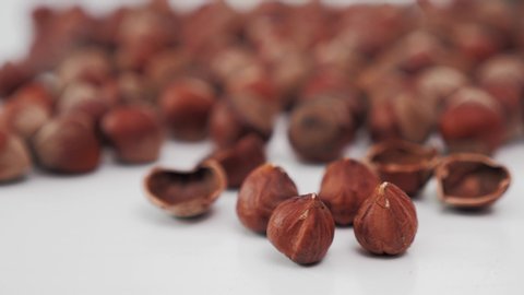 hazelnuts in the depth of field of the inner material and shells of broken nuts