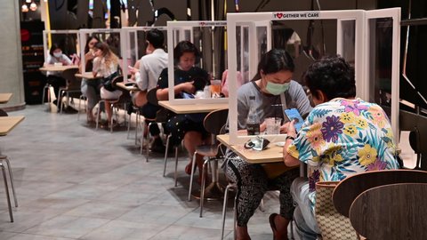 Bangkok, Thailand - May 17, 2020 : Unidentified people at restaurant following social distancing rules