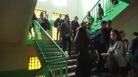 BOBRUISK, BELARUS - May 20, 2019: Pupils go down the stairs of the russian grammar school during the break from a lessons inside gymnasium building. Education without coronavirus