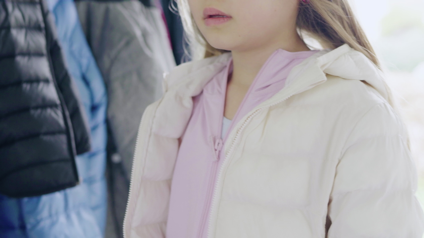 CU Mother assisting daughter (8-9) leaving to school / Denmark