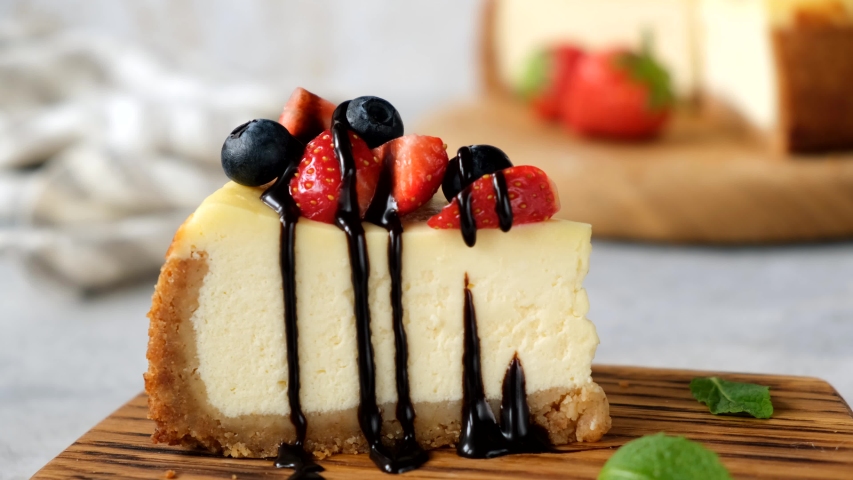 Taking bite of cheesecake with fork. Eating cheesecake Royalty-Free Stock Footage #1052825009