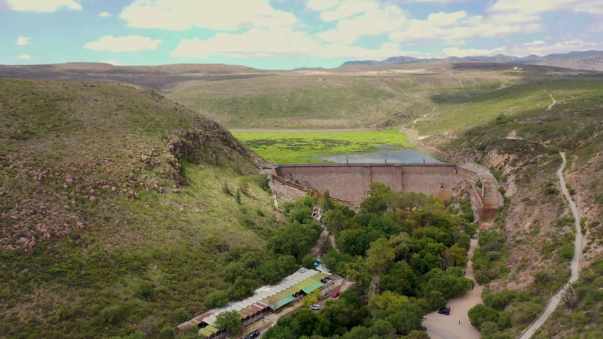 San Jose Dam In the city of San Luis Potosi in Mexico. A dam and a reservoir built on a mountain river. Water plants on the surface of the river. Video made by drone.