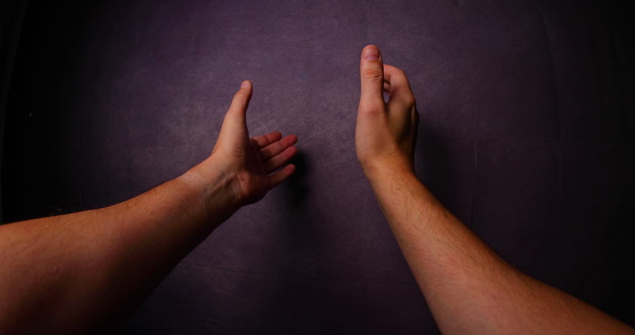 Male hands clapping hands together gesture front of gesture captured from left side looking gracefully in front of camera Fisheye perspective daylight all capture in 4K 60fps slow motion movement