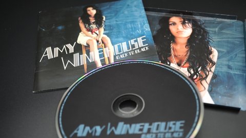 Covers and inserts of British singer-songwriter, stylist, and guitarist AMY WINEHOUSE. He died early on July 23, 2011 for unknown causes, perhaps related to alcohol and drugs