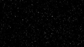 Falling snow flakes. Isolated snowfall. Low speed animated video with depth of field ''DOF'' in isolated black background.