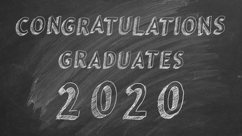 Hand drawing text "Congratulations graduates.  2020." and graduation caps   on blackboard.
