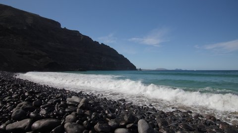 Waves, pebbles, slow motion. Lanzarote beach, 