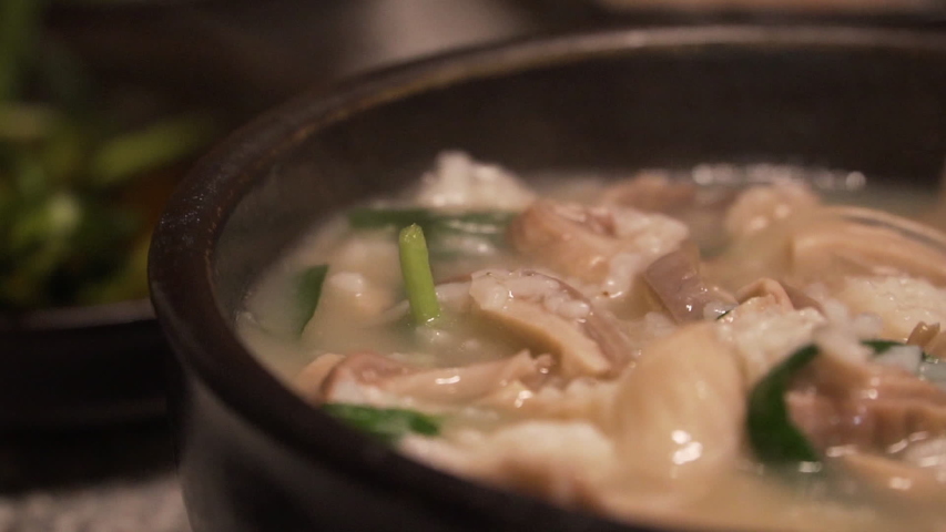 Korean traditional food, Pork and Rice Soup, Dwaeji-gukbap, Busan, South Korea. Royalty-Free Stock Footage #1052863217