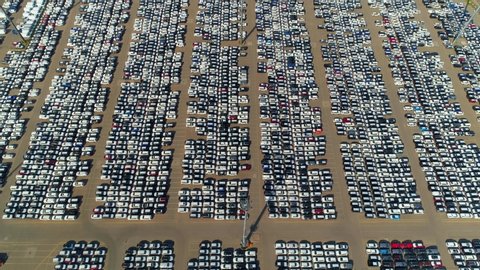 Aerial forward. Large parking many new cars distribution center of modern seaport. Logistics supplies automotive industry. Export import storage. Delivery to car dealers. Metropolis epic parking. 4k